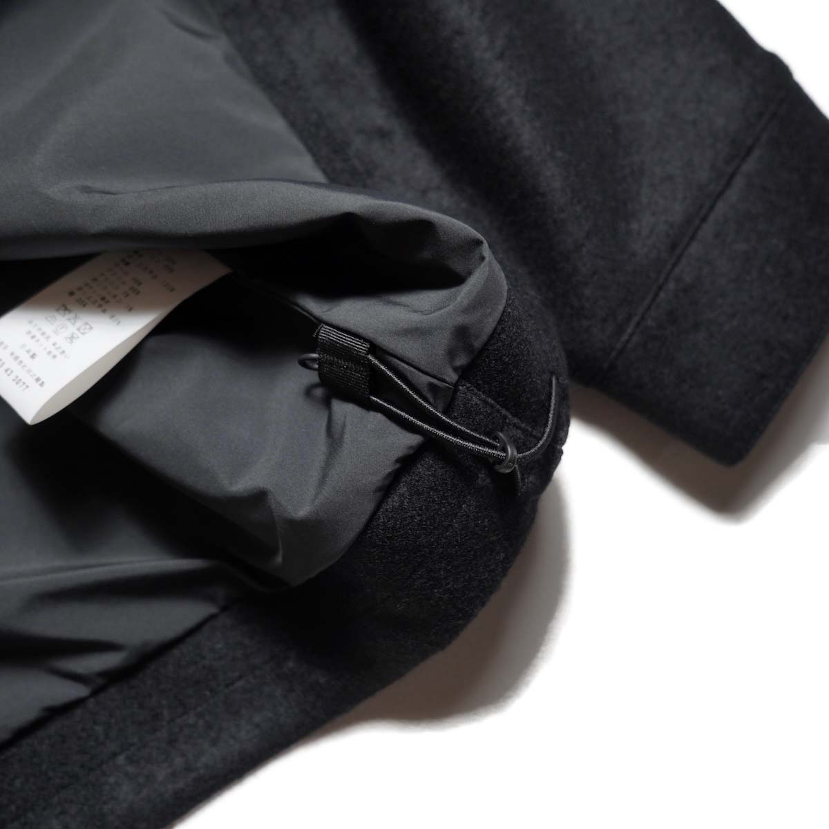 CURLY&Co. / PRESSED WOOL JERSEY BLOUSON (Black) 裾コード