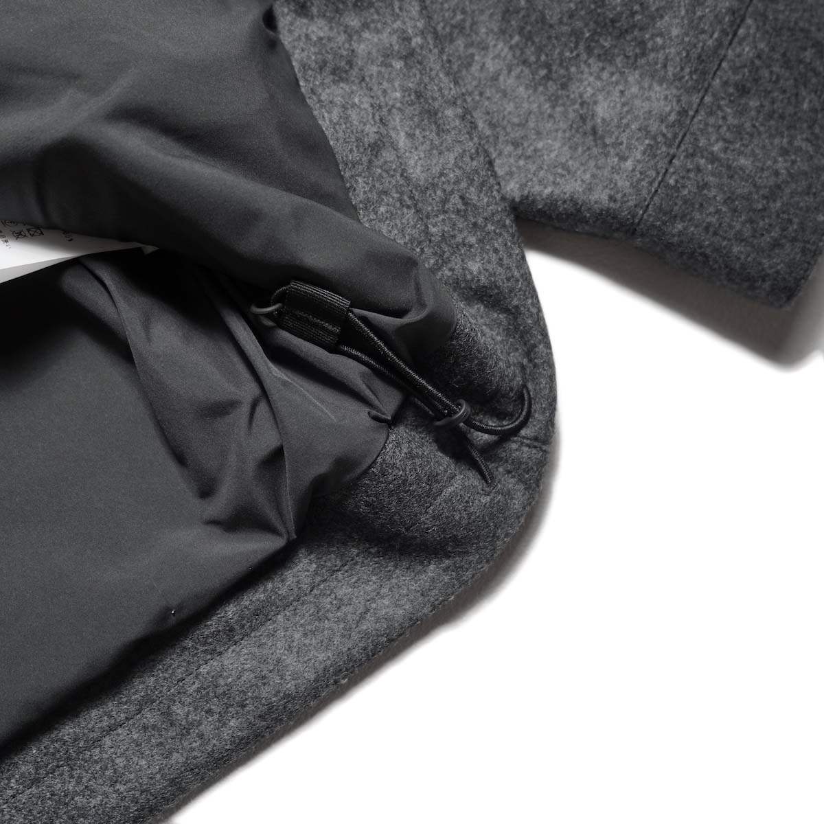 CURLY&Co. / PRESSED WOOL JERSEY BLOUSON (Mix Gray) 裾コード