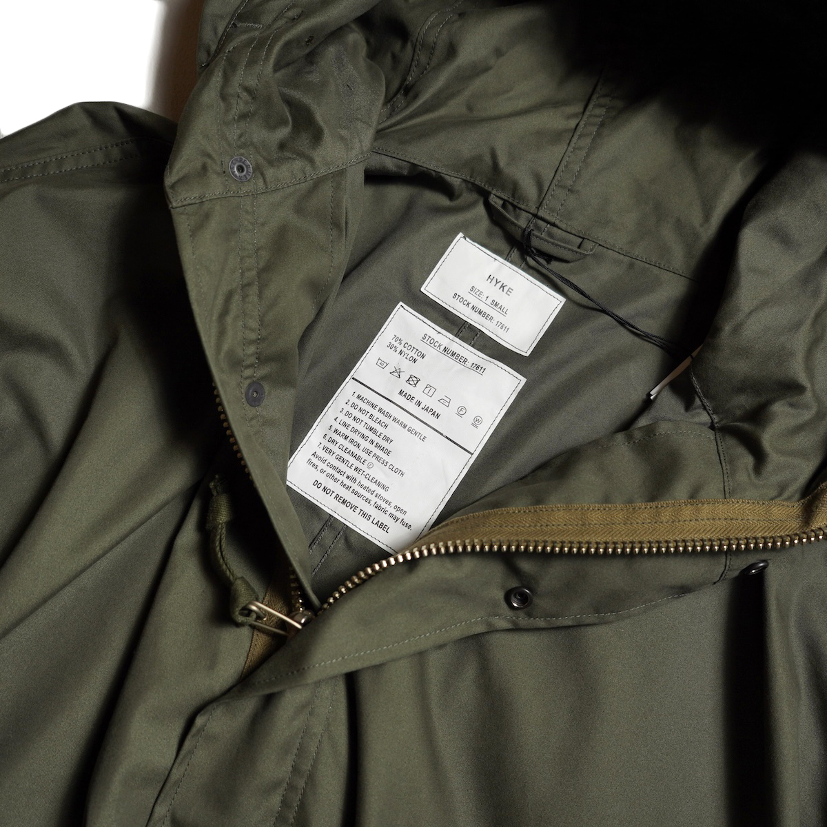 HYKE / N/C TYPE M-48 FIELD COAT (Olive Drab) スペックタグ