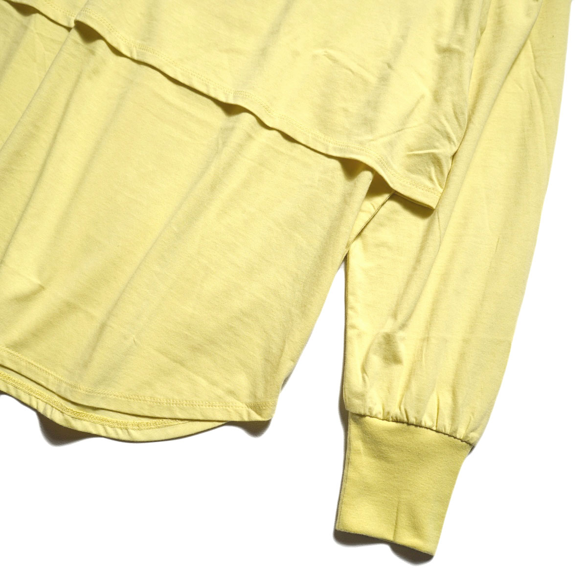 KHA:KI / LAYRED TOP (AshYellow) 袖・裾